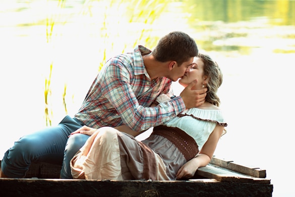 A loving couple walking by the lake - How Does An Aquarius Man Fall In Love