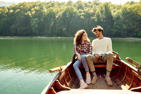 Young couple enjoying their time on a lake