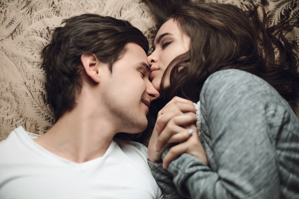 Couple in love laying on the bed